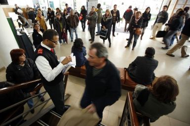 Unemployed people wait for their turn at a government job centre in Seixal February 16, 2011. 