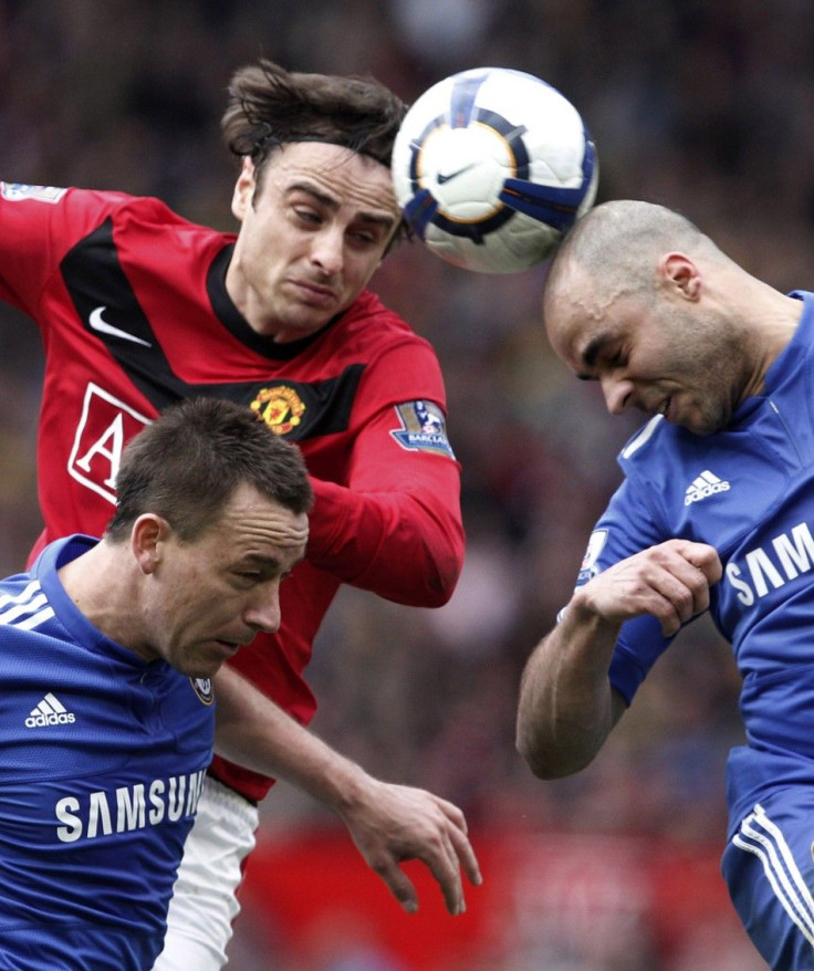 Manchester United's Berbatov challenges Chelsea's Terry and Alex during their English Premier League soccer match in Manchester.