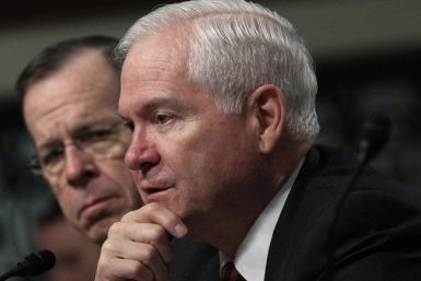 U.S. Secretary of Defense Robert Gates (R) answers questions as Chairman of the Joint Chiefs of Staff Adm. Mike Mullen looks on at a Senate Armed Services Committee hearing on the &quot;Defense Authorization Request for FY2012&quot; on Capitol Hill in Was