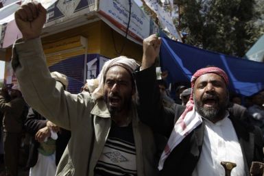 Anti-government protesters shout slogans during a protest demanding the ouster of Yemen's President Ali Abdullah Saleh outside Sanaa