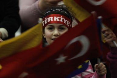 A Turkish girl waves a German and a Turkish flag during the arrival of Turkish Prime Minister Tayyip Erdogan in Duesseldorf