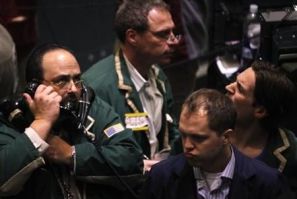 Traders work in the oil options pit on the floor of the New York Mercantile Exchange in New York