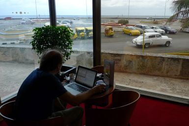Man uses Internet in hotel in Hanava, Cuba 