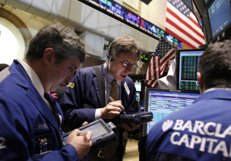 Traders work on the floor of the New York Stock Exchange