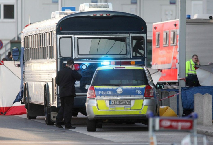 A police car stands next to an U.S. Army bus in front of Frankfurt airport