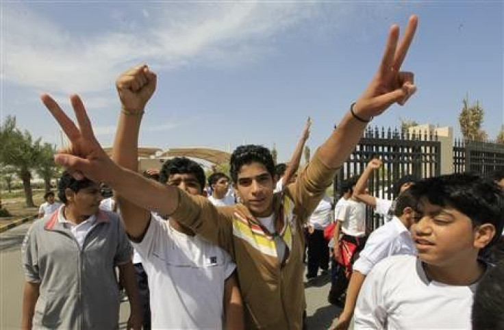High school students gesture, during a protest to demand the resignation of the education minister