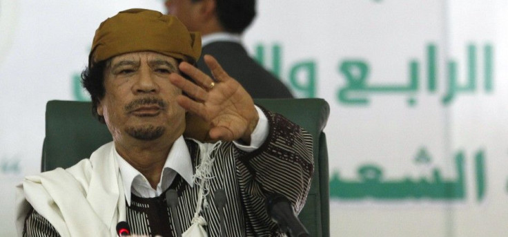 Libya's leader Muammar Gaddafi gestures to his supporters in Tripoli