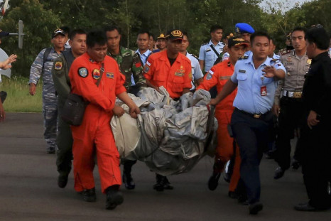 AirAsia personnel carrying possible debri
