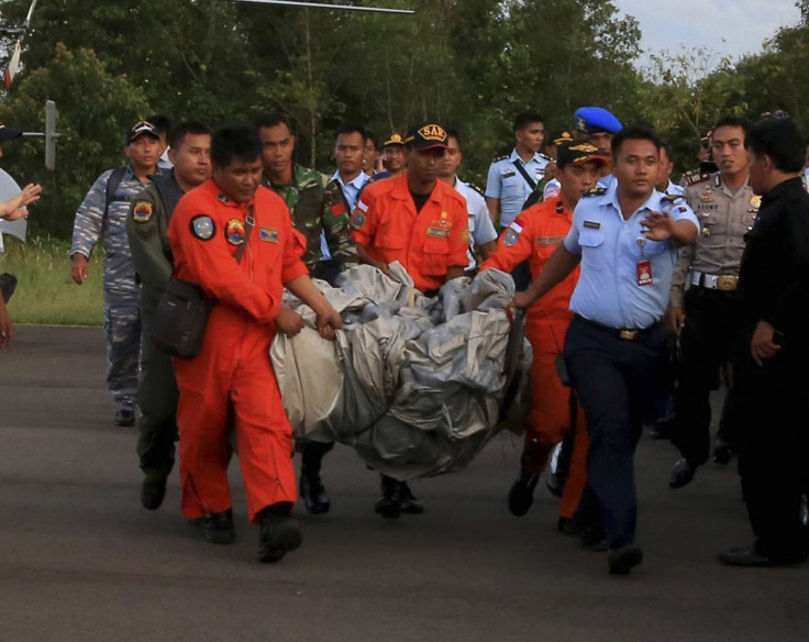 AirAsia personnel carrying possible debri
