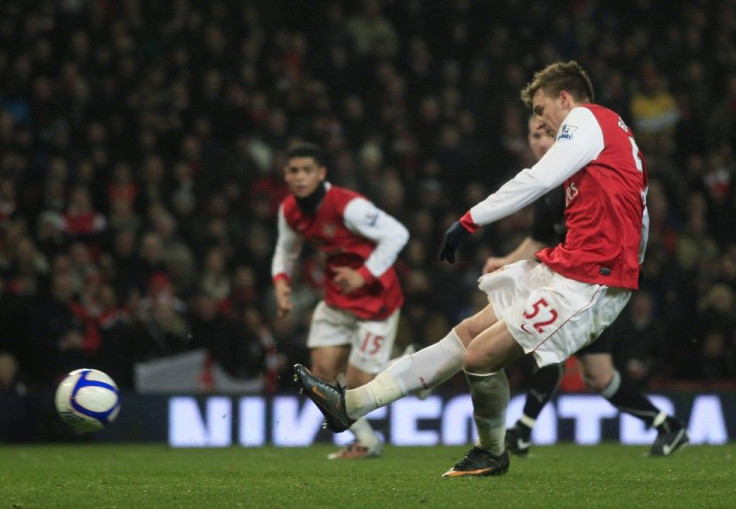 Arsenal's Nicklas Bendtner shoots and scores his third goal against Leyton Orient during their FA Cup soccer match in London.