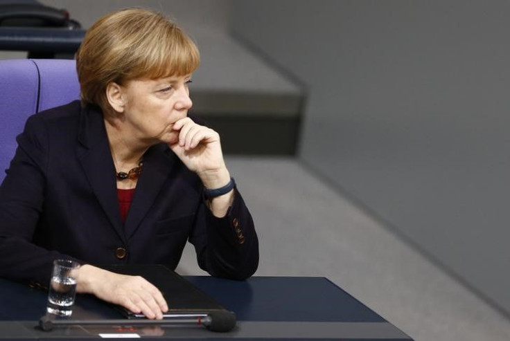 2015-01-07T131329Z_1_LYNXMPEB060K5_RTROPTP_3_RUSSIA-CRISIS-MERKEL