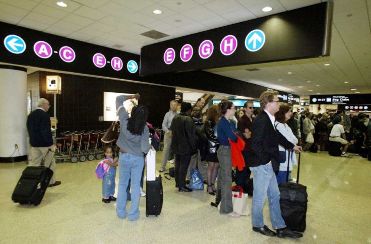 Passengers wait at an International Terminal at Miami International Airport.