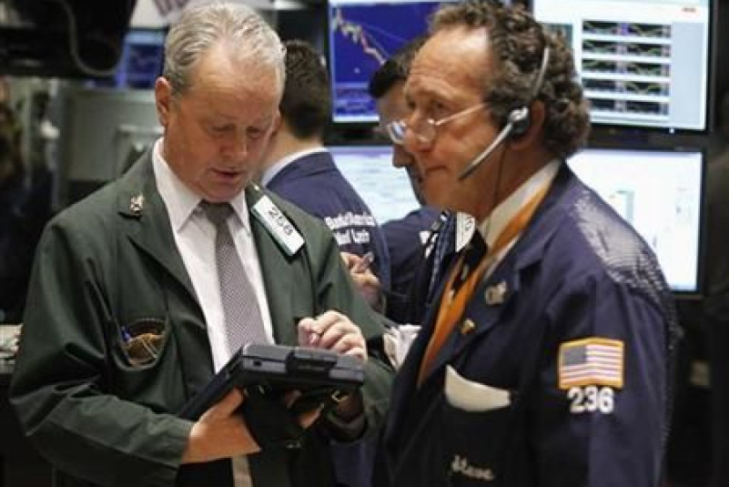 Traders work on the floor of the New York Stock Exchange