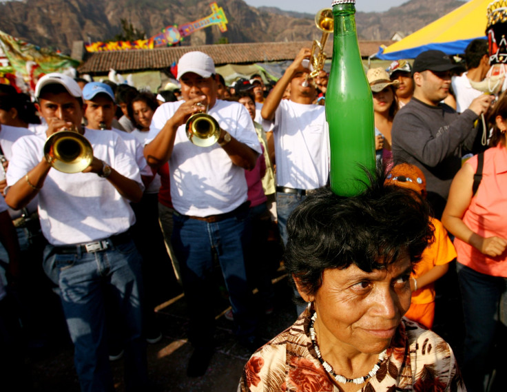 Mexican woman balances soda