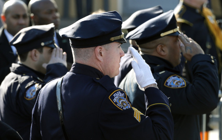 NYPD officers salute