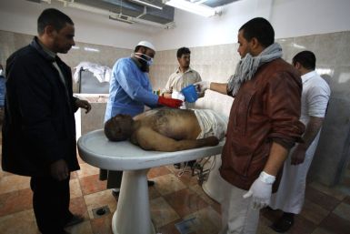 A body of one of the anti-government tribal revolutionary rebels who were killed on Wednesday after armed clashes with pro-Gaddafi forces in Brega city, is being washed at a hospital before burying in a cemetery in Ajdabiya area