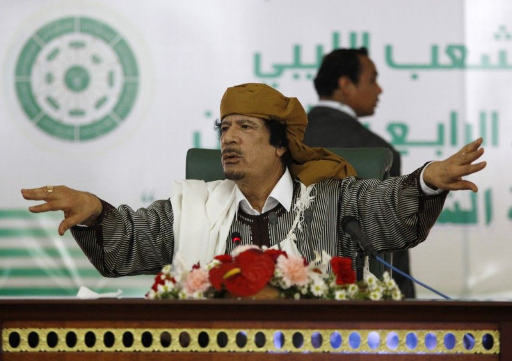 Libya's leader Muammar Gaddafi gestures to his supporters in Tripoli