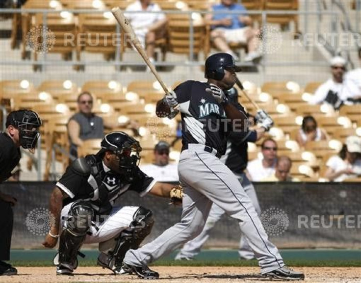 Seattle Mariners left fielder Milton Bradley doubles in the third inning during a MLB spring training baseball game against the Chicago White Sox in Glendale