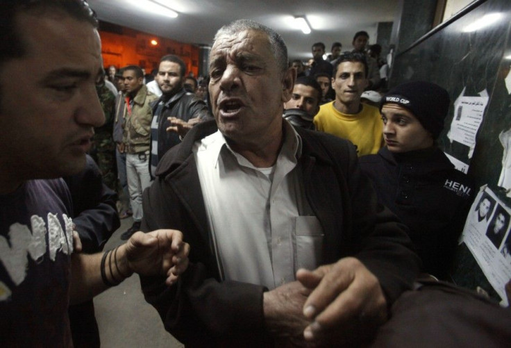 A man reacts after finding out that his relative was killed, at al-Jala hospital in Benghazi