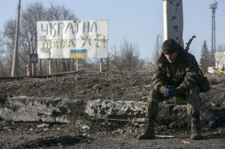 Ukraine soldier sits