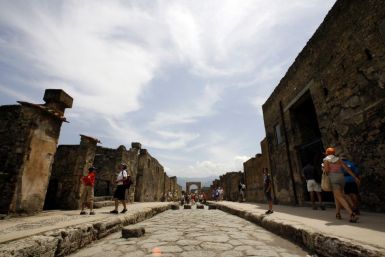 Visitors walk in Pompeii, the famous city next to Naples which was destroyed in AD 79 by the eruption of Mount Vesuvius. 