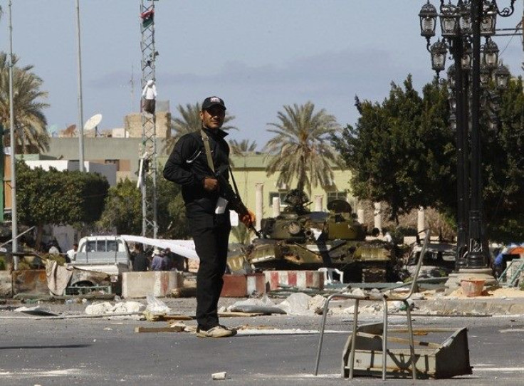 A gunman opposed to leader Muammar Gaddafi stand guard in the centre of the city of Zawiyah, 50 km (30 miles) west of the capital Tripoli, March 5, 2011. Forces loyal to Libyan leader Gaddafi launched a new attack on the western town of Zawiyah on Saturda