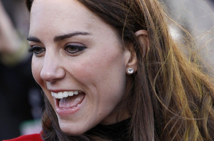 The fiancee of Britain's Prince William, Kate Middleton, smiles during their visit to St. Andrews University, in Fife