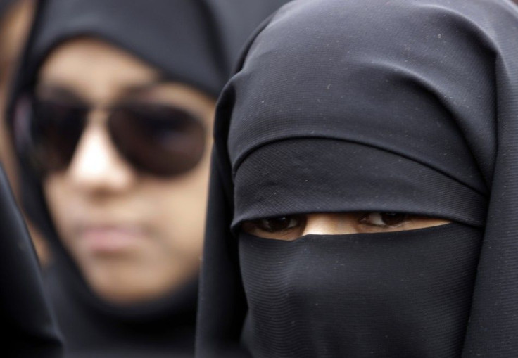 Women attend a rally to demand for the ouster of Yemen's President Ali Abdullah Saleh outside Sanaa University