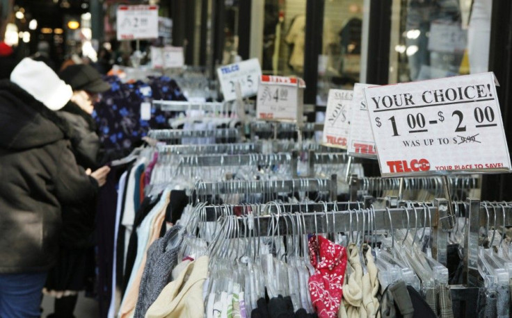 Women shop for clothing at a sidewalk sale in New York March 3, 2011.