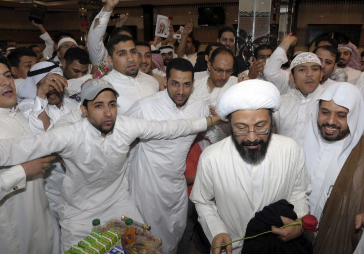 Saudi Shi'ite cleric Tawfiq al-Amir (2nd R) is greeted by his supporters after his release in Al-Ahsa