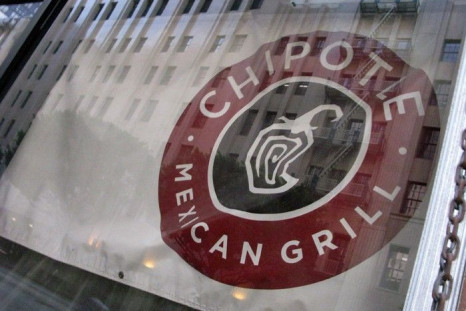 A Chipotle Mexican Grill sign hangs in a window of one of the chains restarants that is under construction in downtown Los Angeles
