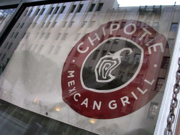A Chipotle Mexican Grill sign hangs in a window of one of the chains restarants that is under construction in downtown Los Angeles