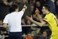 Arsenal's Robin Van Persie argues with referee Busacca after receiving a red card in Arsenal's Champions League encounter against Barcelona.