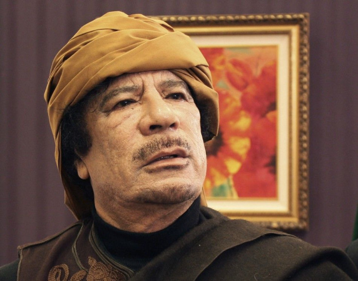 Libya's leader Muammar Gaddafi poses after an interview with TRT Turkish television reporter Mehmet Akif Ersoy at the Rixos hotel in Tripoli March 8, 2011. P