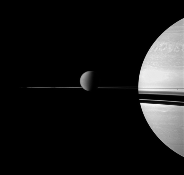 Rain from Enceladus supplies Saturn's upper atmosphere with water