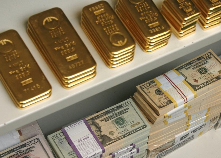 Gold bars and US Dollar bills