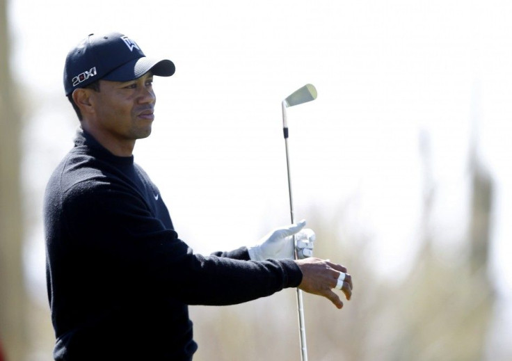 Woods of the US watches his tee shot on the fourth hole during WGC-Accenture Match Play Championships golf tournament in Marana.