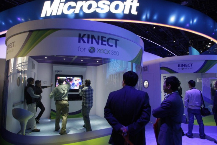 People play a Kinect boxing game on an XBox 360 gaming console at the Microsoft booth during the first day of the International CES in Las Vegas
