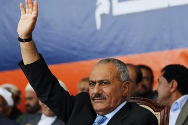 Yemen's President Saleh waves to supporters gathered in a soccer stadium in Sanaa