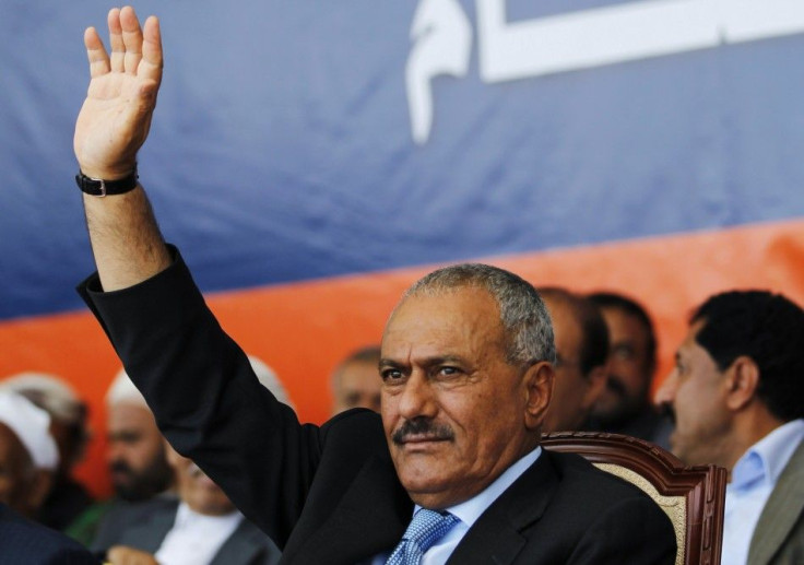 Yemen's President Saleh waves to supporters gathered in a soccer stadium in Sanaa