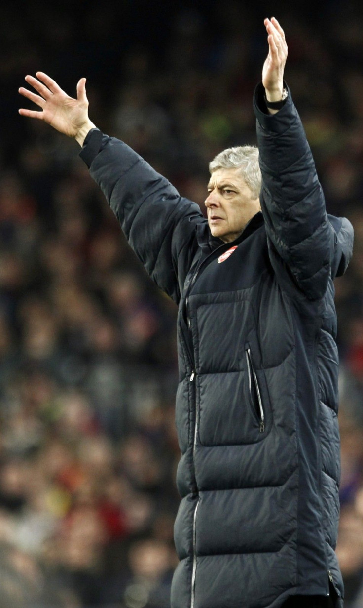 Arsenal's coach Wenger reacts during their Champions League soccer match in Barcelona.