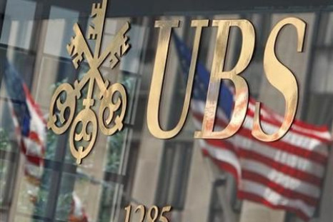 The U.S. flag is seen in a reflection outside the Swiss bank UBS offices in New York