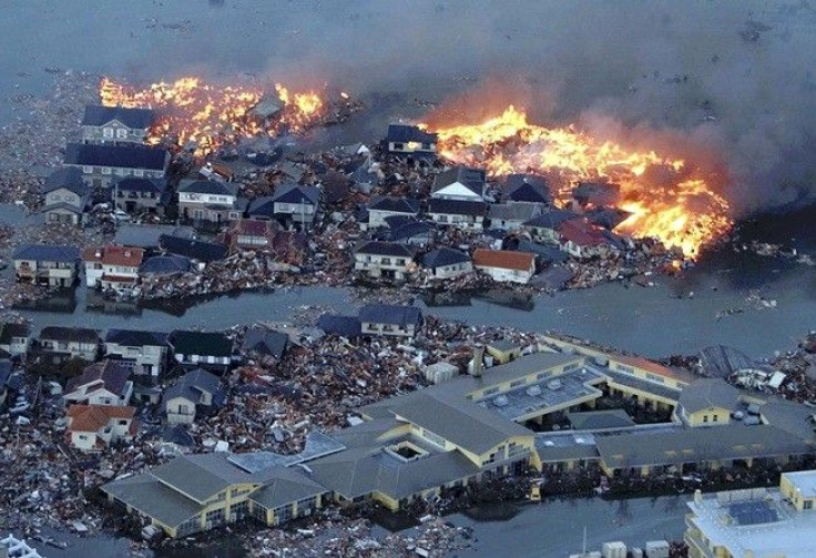 Houses swept out to sea burn following a tsunami and earthquake in Natori City in northeastern Japan March 11, 2011. 