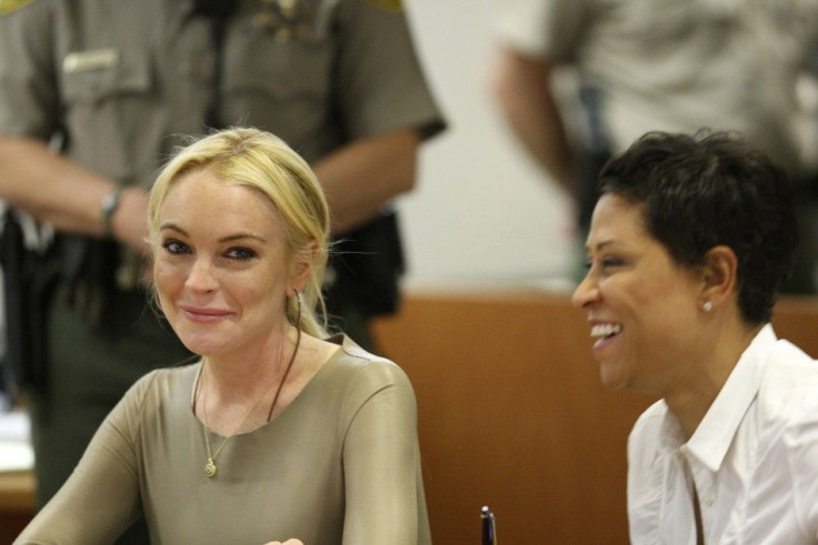 Lindsay Lohan (left) with her lawyer