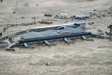 Sendai Airport is flooded after a tsunami following an earthquake in Sendai