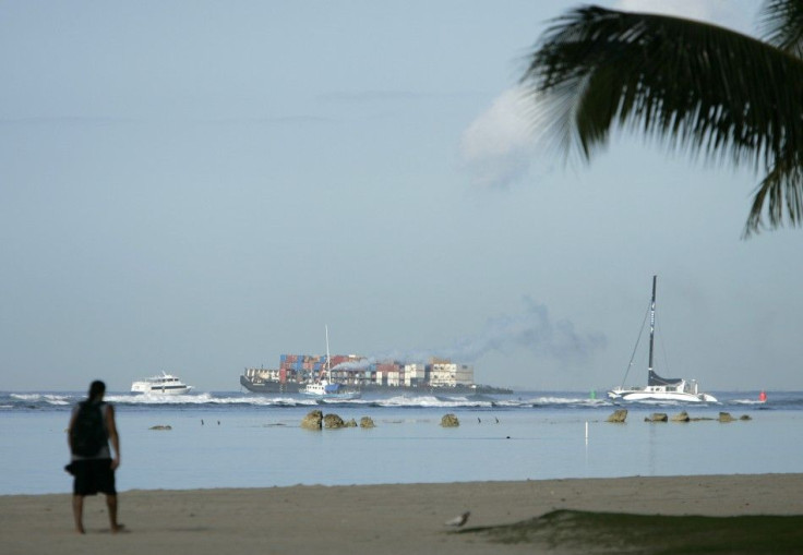 Boats leave Kewalo harbor during a tsunami warning for the Hawaiian Islands in Honolulu, Hawaii.