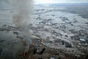 Fires burn in a harbour following an earthquake and tsunami in Natori City, Miyagi Prefecture, northeastern Japan, March 11, 2011.