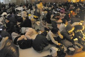 Evacuees take shelter at an evacuation centre during a blackout after an earthquake and tsunami in Sendai, northeastern Japan, March 11, 2011.