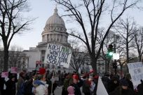 Protesters maintain a presence outside the Wisconsin State Capitol as the Wisconsin State Assembly meets in Madison, Wisconsin