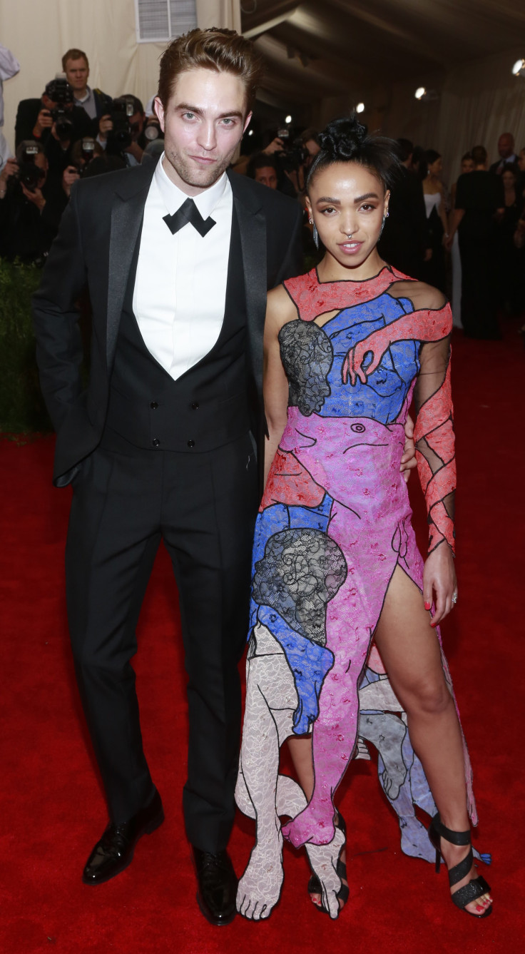 [8:57] British actor Robert Pattinson poses with British singer FKA twigs as they arrive for the Metropolitan Museum of Art Costume Institute Gala 2015